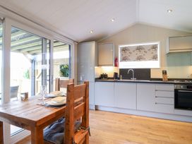 A kitchen with a table and chairs at Hazel in Oakthorpe near Donisthorpe