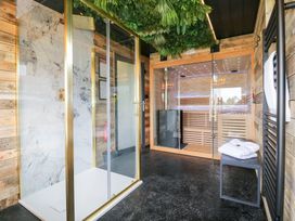 A bathroom with a shower and sauna at Hazel in Oakthorpe near Donisthorpe