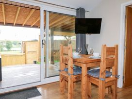 A dining room with a table and chairs at Birch near Oakthorpe
