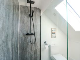 A bathroom with a shower and toilet at Iscoed in Rhosneigr