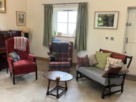 A living room with two armchairs and a sofa at The Croft in Newtown-Crommelin near Cloughmills