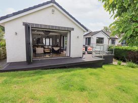 An outdoor area with a deck and furniture at Yonder Lea Bowness-On-Windermere