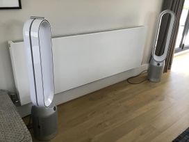 A living room with air purifiers and a heater at Yonder Lea in Bowness-On-Windermere