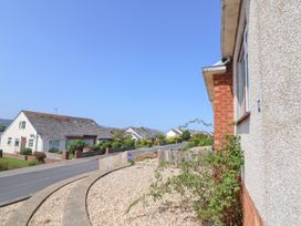 A street view with houses and gravel front gardens at Bryn Bach in Rhos-On-Sea