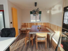 A dining room with a table and chairs at The Hideaway 