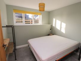 A bedroom with a mattress and window at The Hideaway 