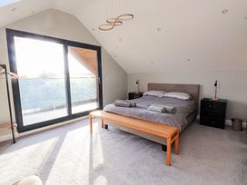A bedroom with a bed and a window at The Hideaway in 