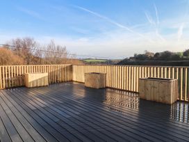 A deck area with wooden planters at The Hideaway
