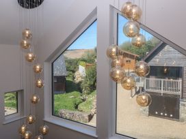 A lighting feature and windows in a property at The Hideaway in Mynytho near Abersoch