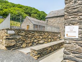 A stone pathway and buildings at The Haystore in Corwen
