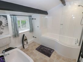 A bathroom with a bath tub and shower at The LA'AL Cragg in Kirkby Stephen