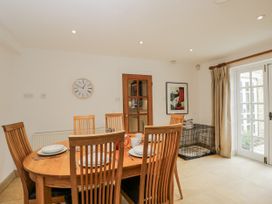 A dining room with a table and chairs at The Old Hall in Tetbury
