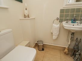 A bathroom with a toilet and sink at The Old Hall in Tetbury
