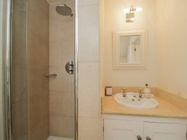 A bathroom featuring a shower and a sink at The Old Hall in Tetbury
