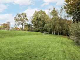 An outdoor area with a goalpost and trees at The Old Hall in Tetbury