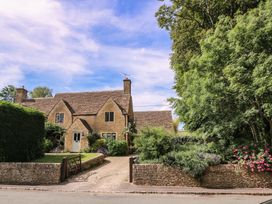 A house with garden and driveway at The Old Hall Westonbit Nr Tetbury