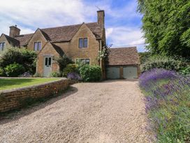 A house with a garage and garden at The Old Hall in Westonbit Nr Tetbury