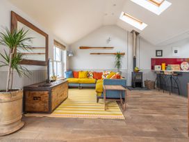 A living room with a sofa and coffee table at 14 Marine Parade Lyme Regis