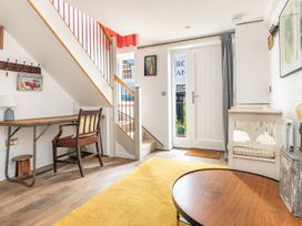 An entryway with a table and chair at 14 Marine Parade in Lyme Regis