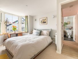 A bedroom with a bed and a desk at 14 Marine Parade in Lyme Regis