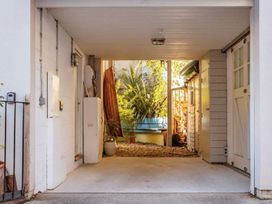 A garage with a gravel area and plants at 14 Marine Parade Lyme Regis