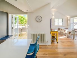 A kitchen with a table and chairs at Port House in Lyme Regis