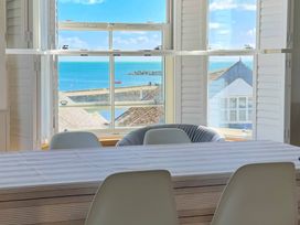 A dining room with a view of the sea at Port House in Lyme Regis