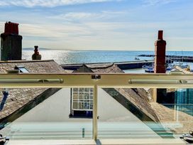 A view of the sea and harbor from a window at Port House in Lyme Regis