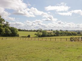 A field with grass and trees at Keepers Barn Bromyard