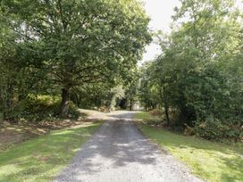 A path surrounded by trees at Keepers Barn in Bromyard