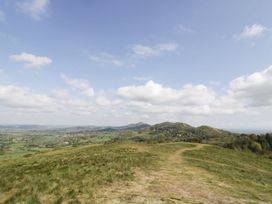 A landscape view of hills and valleys with clouds in the sky at Keepers Barn Bromyard