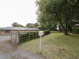 An outdoor view with a building and pathway at The Cow Shed in Bromyard