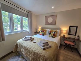 A bedroom with a bed and desk at Ty Barddu in Cwmorgan near Newcastle Emlyn