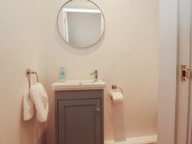 A bathroom with a sink and mirror at Silver How in Ambleside