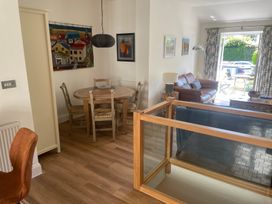 A living room with a dining area and furniture at Hamnavoe Stoke Fleming