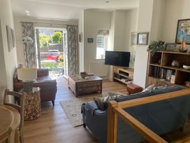 A living room with a coffee table and sofa at Hamnavoe in Stoke Fleming