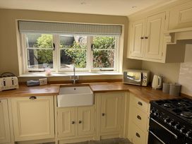 A kitchen with a sink and appliances at Malabar House in Lyme Regis