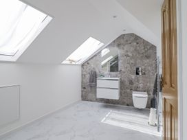 A bathroom with skylights and a vanity at Neptune Cottage in Conwy