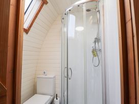 A bathroom with a shower and toilet at Pod 2 Beauly