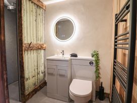 A bathroom with a sink and toilet at Godre'r Gyrn, Plas Moelfre Hall Barns, Oswestry