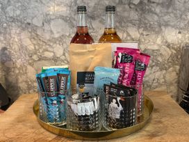 A tray with drinks and snacks in the kitchen at Astondene, East Cliff, Southwold