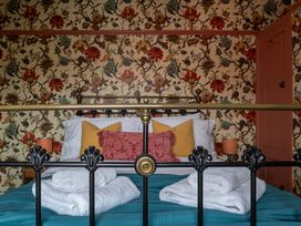 A bedroom with a bed and pillows at Astondene, East Cliff Southwold
