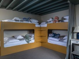 A bedroom with bunk beds and toys at Astondene, East Cliff Southwold