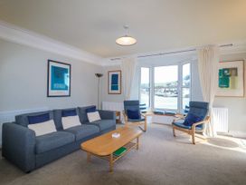 A living room with a sofa and coffee table at Harbourside in Dartmouth