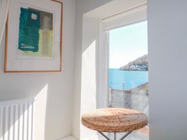 A table by a window with a view of water at Harbourside in Dartmouth