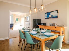 A dining room with a table set for dinner at Harbourside in Dartmouth