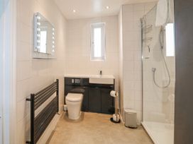 A bathroom with a sink, toilet, and shower at Harbourside in Dartmouth