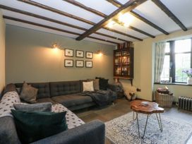 A living room with a sofa and coffee table at Windyridge in Gwaenysgor, near Prestatyn