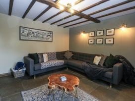 A living room with a sofa and coffee table at Windyridge, Gwaenysgor, near Prestatyn