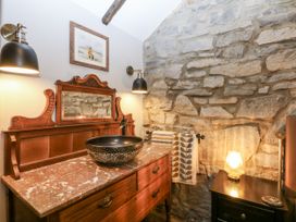 A bathroom with a sink and mirror at Windyridge in Gwaenysgor, near Prestatyn